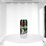 photo of a beer can inside a photo studio