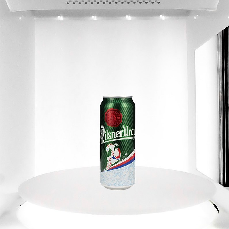 photo of a beer can inside a photo studio
